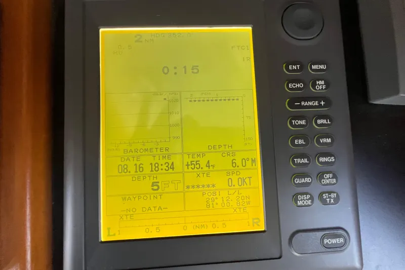 Slide: The Image of Interior of 1989 Hans Christian INDEPENDENCE 45 TRAWLER with wooden cabinetry and porthole window. - 113