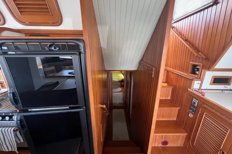 Slide: The Image of Control panel on 1989 Hans Christian INDEPENDENCE 45 TRAWLER, mounted under wooden shelf. - 125