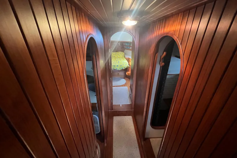 Slide: The Image of Bathroom interior of 1989 Hans Christian INDEPENDENCE 45 TRAWLER with wooden accents and stainless steel sink. - 126