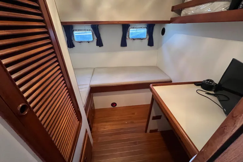 Slide: The Image of Interior of 1989 Hans Christian INDEPENDENCE 45 TRAWLER bathroom with wooden accents and porthole window. - 129