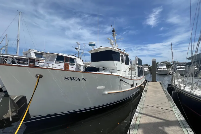 Slide: The Image of 1989 Hans Christian INDEPENDENCE 45 TRAWLER bow with mooring line and deck fittings at marina. - 13