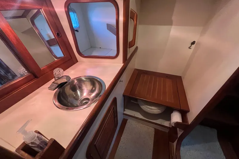 Slide: The Image of Engine room of 1989 Hans Christian INDEPENDENCE 45 TRAWLER with fire extinguisher and fuel filters. - 137