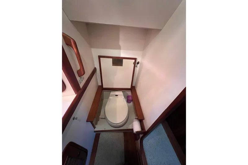 Slide: The Image of Engine room of 1989 Hans Christian INDEPENDENCE 45 TRAWLER with visible hoses and components. - 138