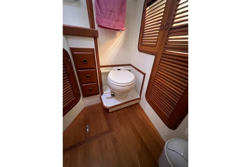 Slide: The Image of Engine room of 1989 Hans Christian INDEPENDENCE 45 TRAWLER with red machinery and wiring. - 154