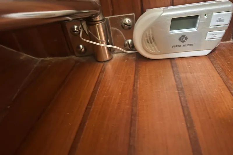 Slide: The Image of Engine mount detail of 1989 Hans Christian INDEPENDENCE 45 TRAWLER, showcasing red metal components. - 155