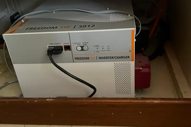 Slide: The Image of Engine room of 1989 Hans Christian INDEPENDENCE 45 TRAWLER with red machinery and wiring. - 160