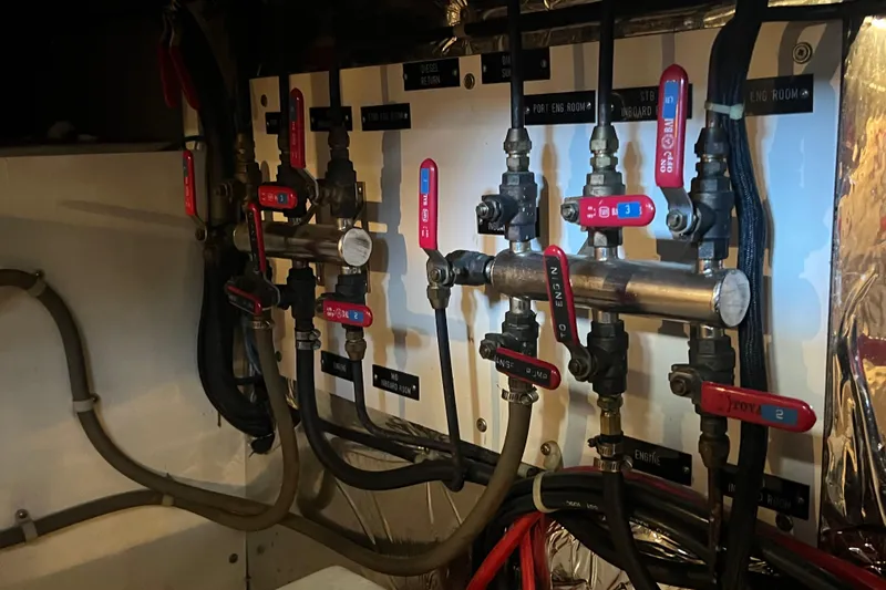 Slide: The Image of Engine room of 1989 Hans Christian INDEPENDENCE 45 TRAWLER with complex wiring and piping. - 163