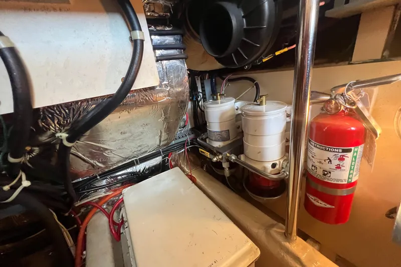 Slide: The Image of Engine room of 1989 Hans Christian INDEPENDENCE 45 TRAWLER with mechanical components and piping. - 165