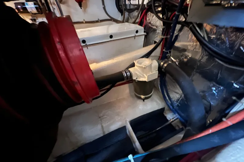 Slide: The Image of Engine room of 1989 Hans Christian INDEPENDENCE 45 TRAWLER with red mechanical components. - 166