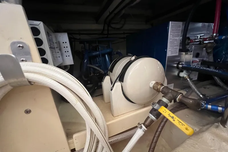 Slide: The Image of Engine room of 1989 Hans Christian INDEPENDENCE 45 TRAWLER, showcasing mechanical components and piping. - 168