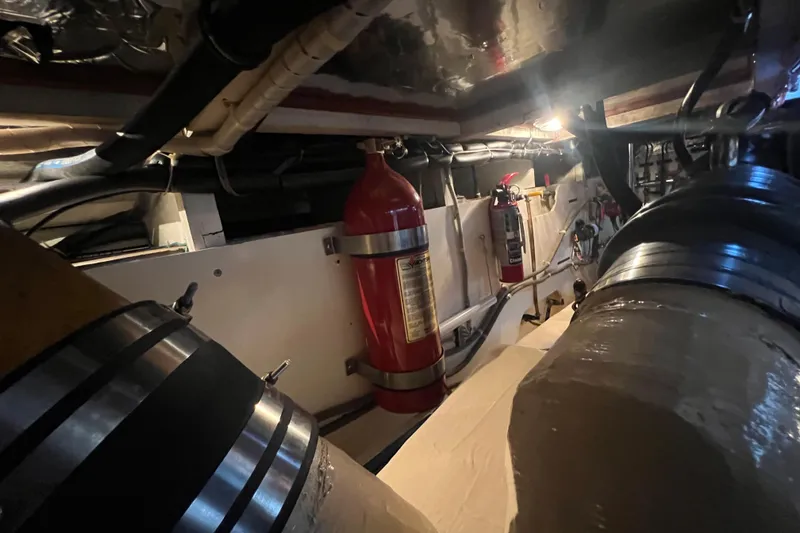 Slide: The Image of Engine room of 1989 Hans Christian INDEPENDENCE 45 TRAWLER with mechanical components and piping. - 169