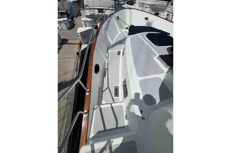Slide: The Image of 1989 Hans Christian INDEPENDENCE 45 TRAWLER, front view with windows and radar, under cloudy sky. - 21