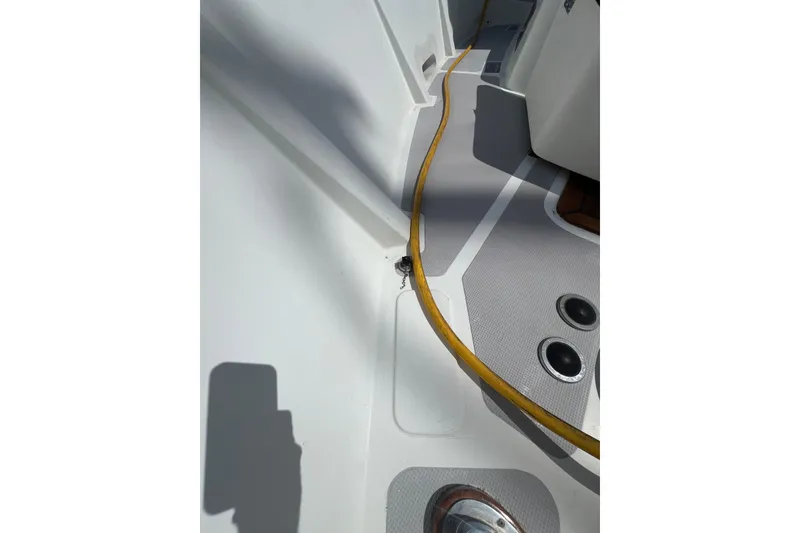 Slide: The Image of 1989 Hans Christian INDEPENDENCE 45 TRAWLER docked in a marina under a clear blue sky. - 27