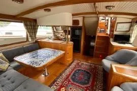 Slide: The Image of 1989 Hans Christian INDEPENDENCE 45 TRAWLER docked at marina under blue sky. - 3