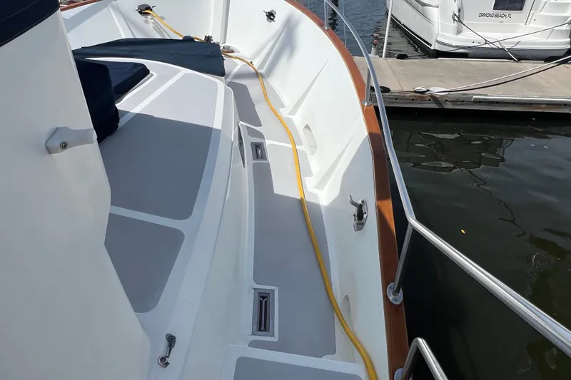 Slide: The Image of Deck detail of 1989 Hans Christian INDEPENDENCE 45 TRAWLER, featuring metal fittings and shadow. - 31