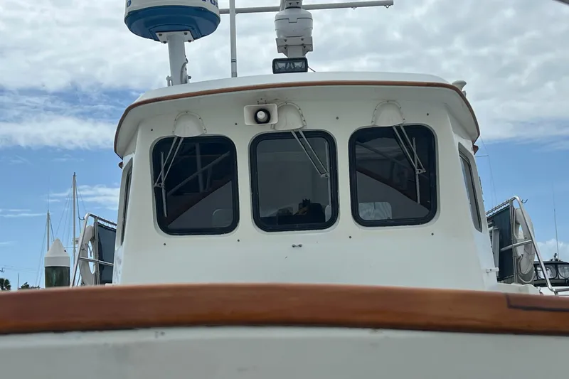 Slide: The Image of Deck of 1989 Hans Christian INDEPENDENCE 45 TRAWLER with storage box, docked at marina. - 33