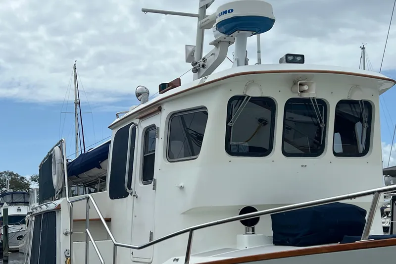 Slide: The Image of 1989 Hans Christian INDEPENDENCE 45 TRAWLER docked at marina, named "SWAN". - 34