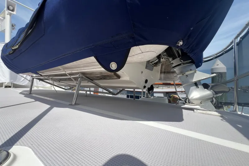 Slide: The Image of 1989 Hans Christian INDEPENDENCE 45 TRAWLER aft deck with marina view, featuring ladder and seating. - 37