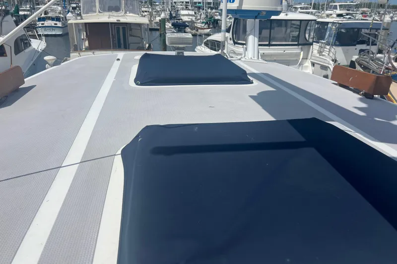 Slide: The Image of Open storage compartment on 1989 Hans Christian INDEPENDENCE 45 TRAWLER, showing propane tank setup. - 41