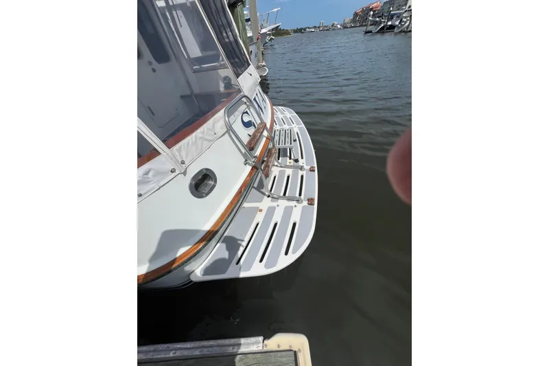 Slide: The Image of Cozy interior of 1989 Hans Christian INDEPENDENCE 45 TRAWLER with striped cushions and curtains. - 49