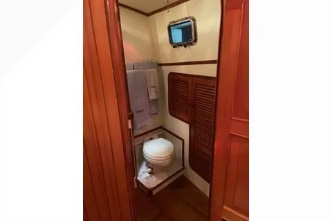 Slide: The Image of 1989 Hans Christian INDEPENDENCE 45 TRAWLER docked at marina under blue sky. - 5