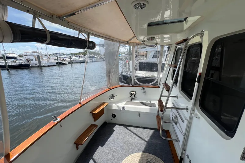 Slide: The Image of Interior of 1989 Hans Christian INDEPENDENCE 45 TRAWLER with storage under cushioned seating. - 50