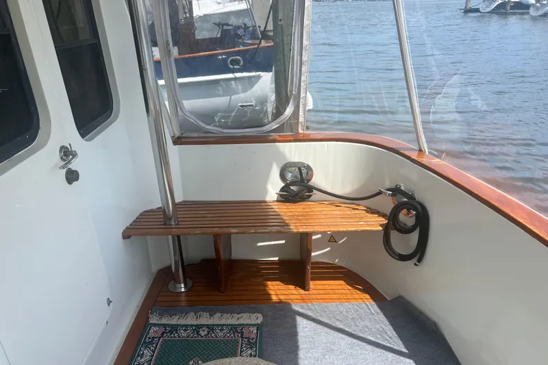 Slide: The Image of Interior of 1989 Hans Christian INDEPENDENCE 45 TRAWLER with wooden flooring and blue seating. - 51