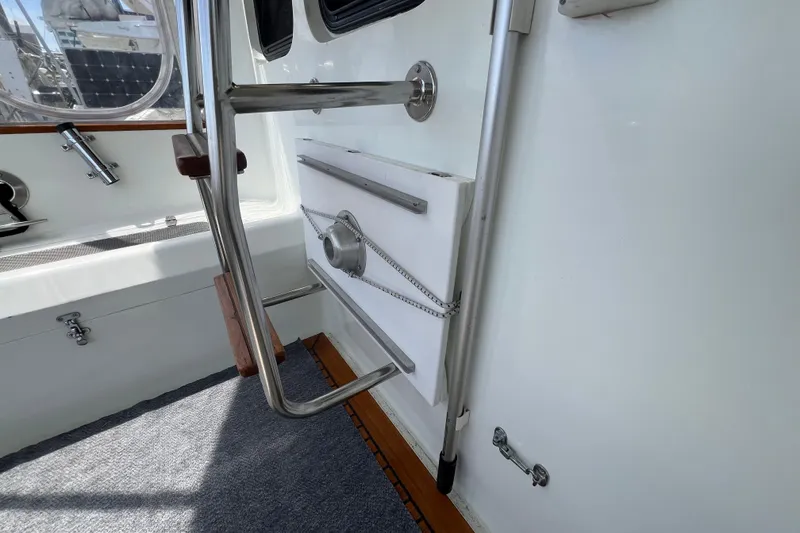 Slide: The Image of Wooden interior of 1989 Hans Christian INDEPENDENCE 45 TRAWLER with stairs and louvered cabinet. - 55