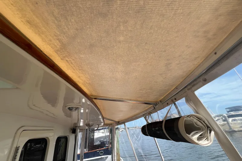 Slide: The Image of Wooden cabinet with glassware inside, aboard a 1989 Hans Christian INDEPENDENCE 45 TRAWLER. - 57