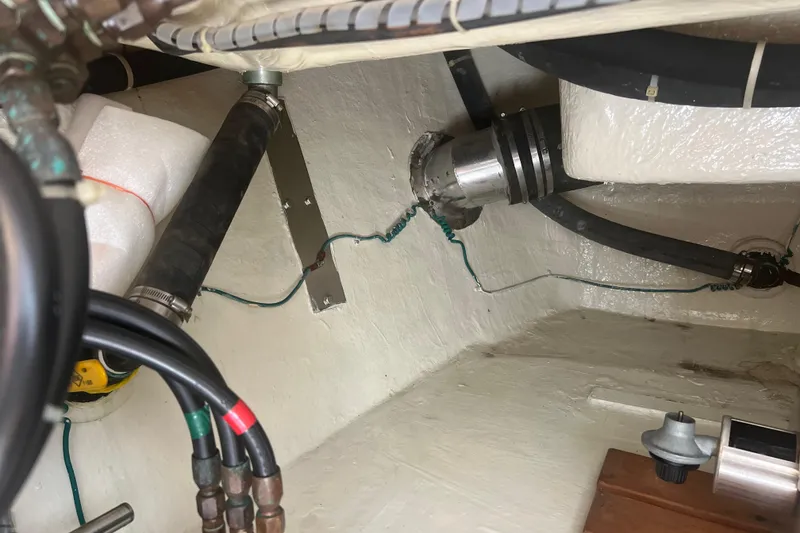 Slide: The Image of Interior of 1989 Hans Christian INDEPENDENCE 45 TRAWLER with wooden cabinetry and cozy seating area. - 65