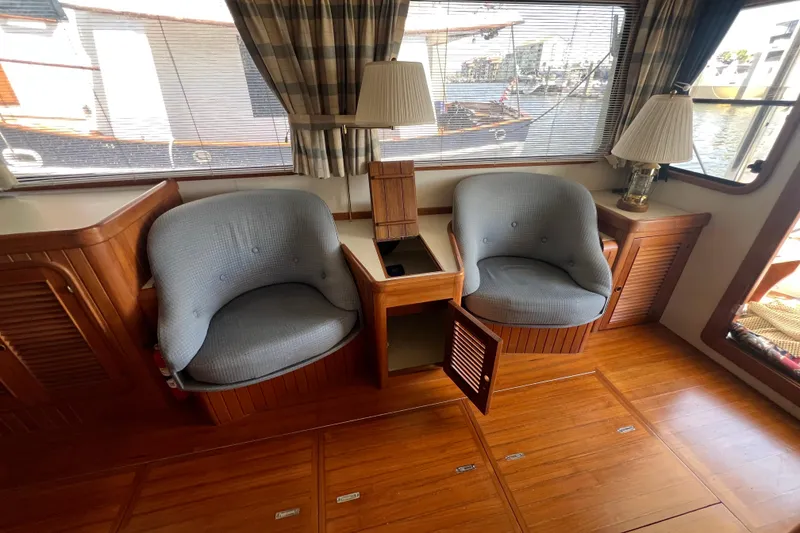 Slide: The Image of Interior of 1989 Hans Christian INDEPENDENCE 45 TRAWLER with wood paneling and blue seating. - 71