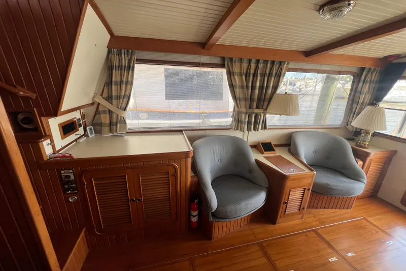 Slide: The Image of Interior view of 1989 Hans Christian INDEPENDENCE 45 TRAWLER helm, showcasing navigation equipment and marina. - 73