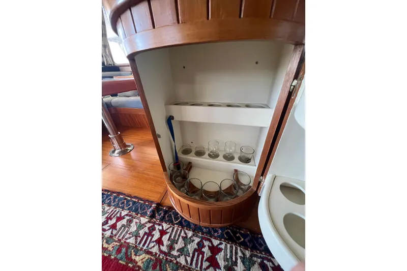 Slide: The Image of Interior view of 1989 Hans Christian INDEPENDENCE 45 TRAWLER, showcasing navigation equipment and wooden paneling. - 74