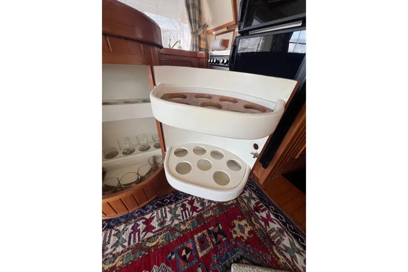 Slide: The Image of Interior view of 1989 Hans Christian INDEPENDENCE 45 TRAWLER, showcasing navigation equipment and marina through windows. - 75