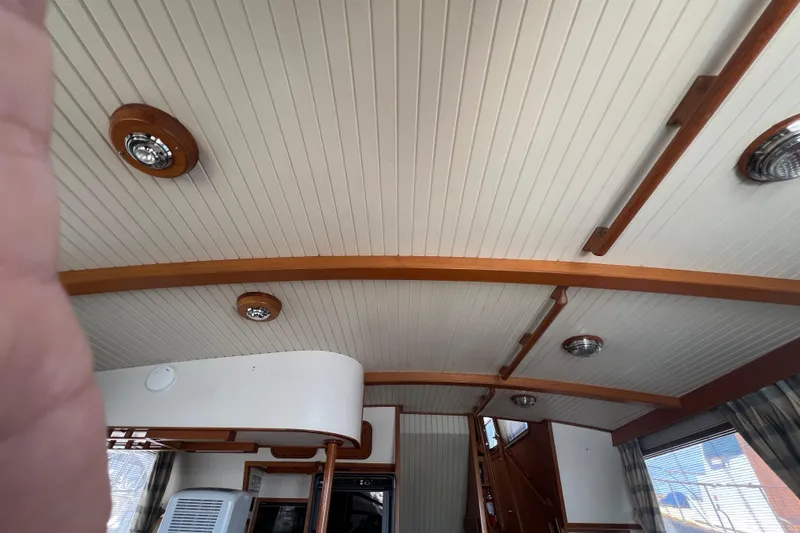 Slide: The Image of Interior of 1989 Hans Christian INDEPENDENCE 45 TRAWLER with wooden paneling and nautical decor. - 76