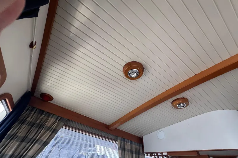 Slide: The Image of Interior of 1989 Hans Christian INDEPENDENCE 45 TRAWLER with wood paneling and seating. - 77