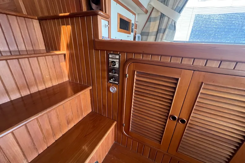 Slide: The Image of Control panel of a 1989 Hans Christian INDEPENDENCE 45 TRAWLER with various switches and knobs. - 87