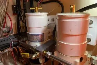 Slide: The Image of Open storage compartment on 1989 Hans Christian INDEPENDENCE 45 TRAWLER with hose and fuel container. - 9