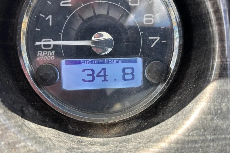 Slide: The Image of Close-up of a 2018 Monterey 275 Sport Yacht engine hour meter displaying 34.8 hours. - 29