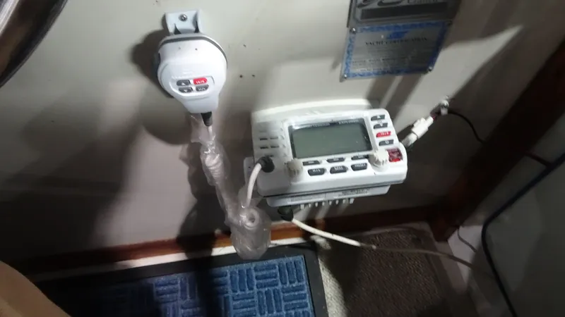 Slide: The Image of Sea Ray 340 Sundancer 1987 control panel with radio equipment. - 11