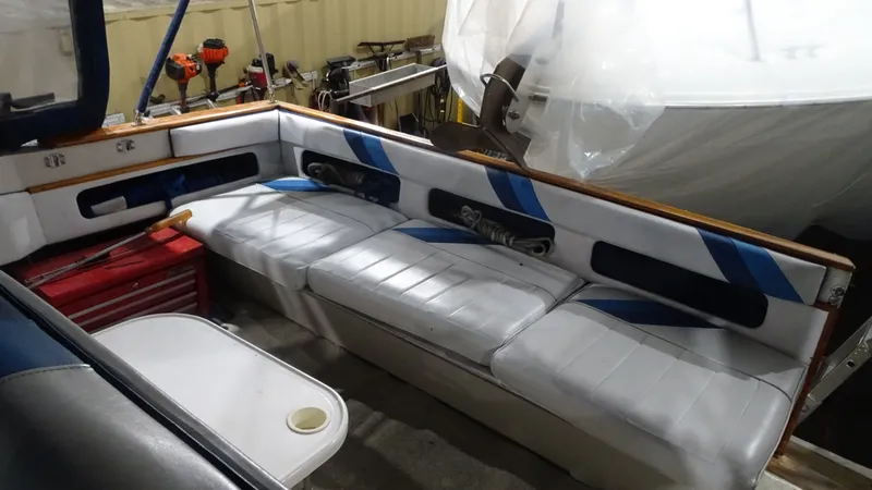 Slide: The Image of Interior of a 1987 Sea Ray 340 Sundancer with white upholstered seating. - 12