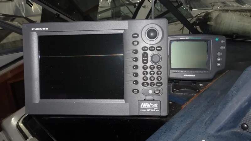 Slide: The Image of Navigation systems on a 1987 Sea Ray 340 Sundancer boat. - 13