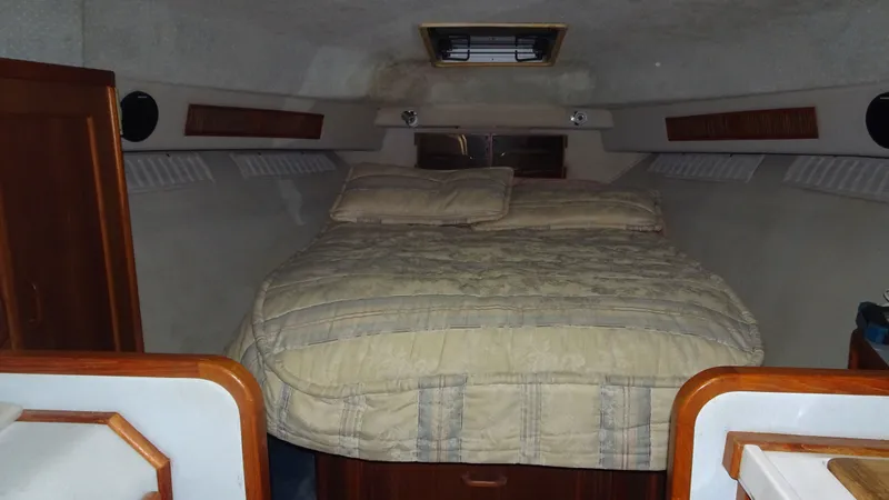 Slide: The Image of Interior of 1987 Sea Ray 340 Sundancer with cozy bed. - 16