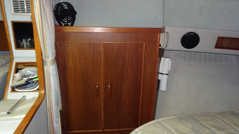 Slide: The Image of Interior of 1987 Sea Ray 340 Sundancer with wooden cabinet. - 17