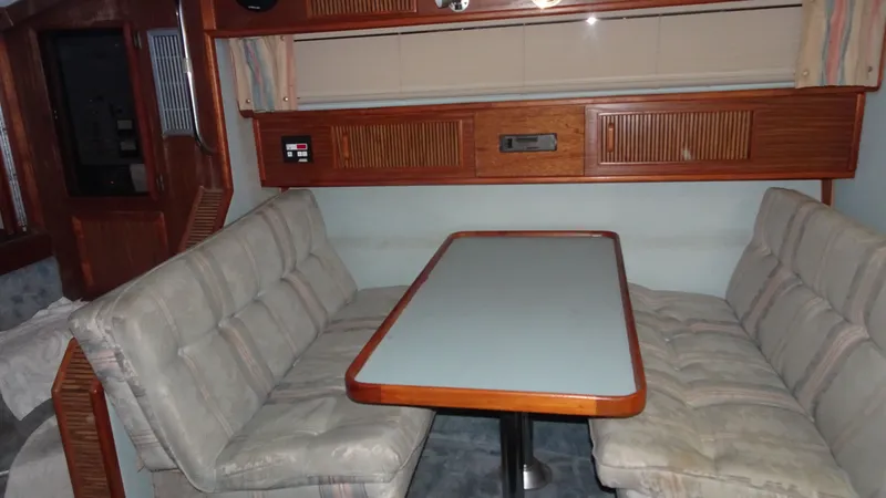 Slide: The Image of Interior of 1987 Sea Ray 340 Sundancer with dining area. - 21