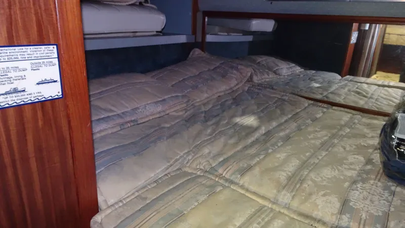 Slide: The Image of Interior of 1987 Sea Ray 340 Sundancer with cozy bed. - 23