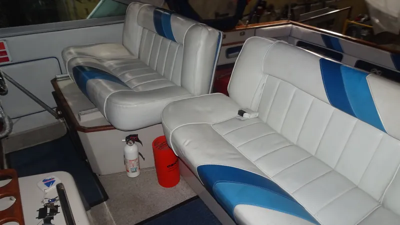 Slide: The Image of Interior of 1987 Sea Ray 340 Sundancer with white and blue seating. - 5
