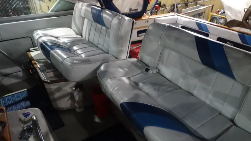 Slide: The Image of Interior of a 1987 Sea Ray 340 Sundancer with blue and gray seating. - 7
