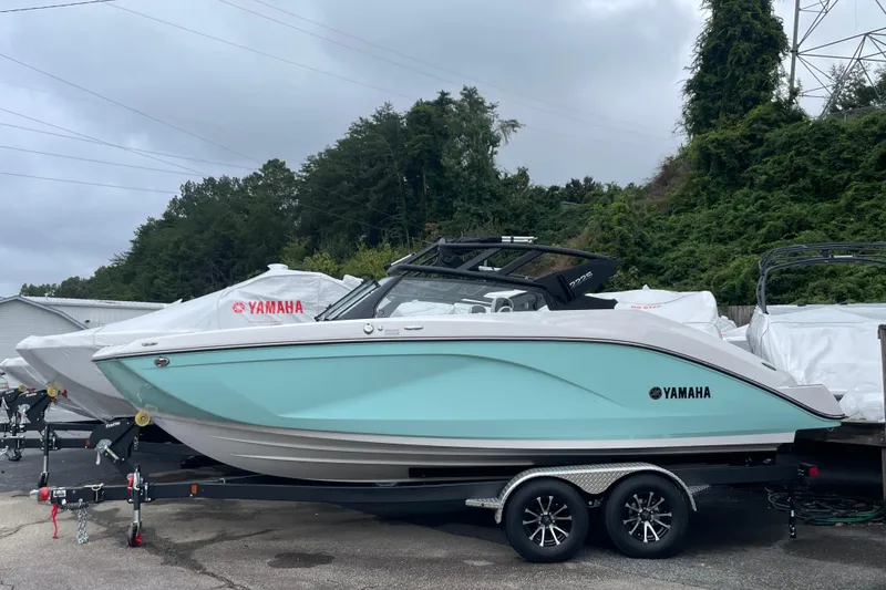 The Image of 2026 Yamaha Boats 222S in light blue on trailer, parked outdoors. - 0