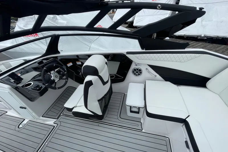 Slide: The Image of 2026 Yamaha Boats 222S interior with sleek design, modern dashboard, and comfortable seating. - 12